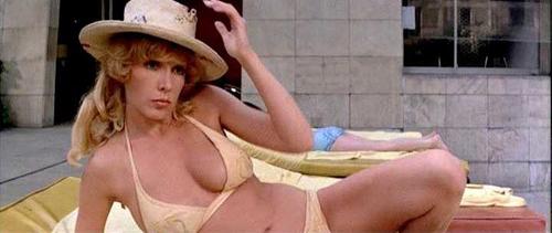 Stella Stevens taking off her sexy blue bikini and posing naked outside at  a pool